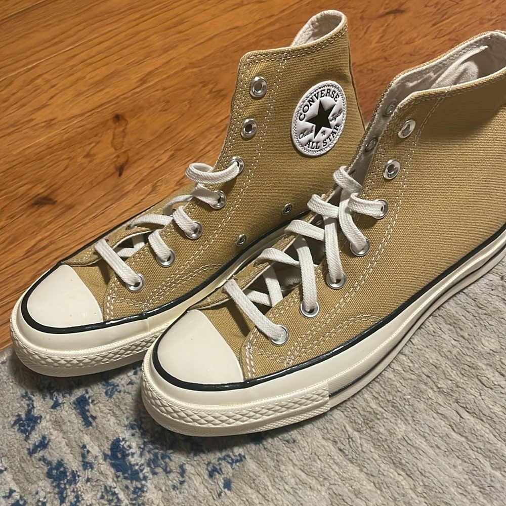 NWOT. Mustard color Converse high top shoes.  Women’s size 7.5 men’s size 5.5.